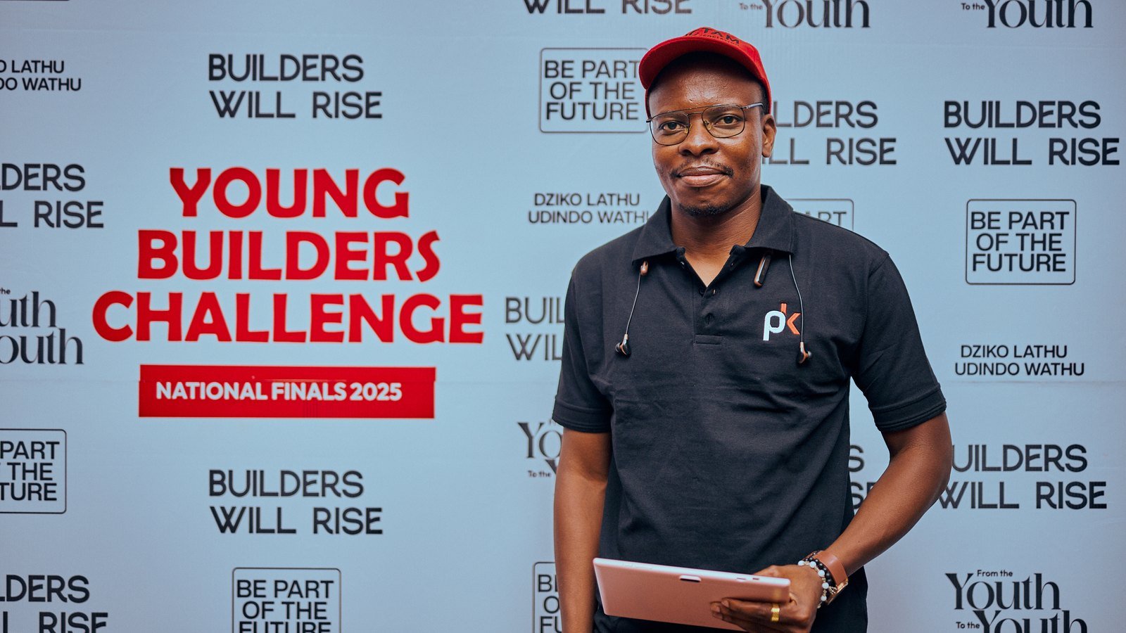 Paul Katema Foundation representative at the Young Builders Challenge Season 1 backdrop