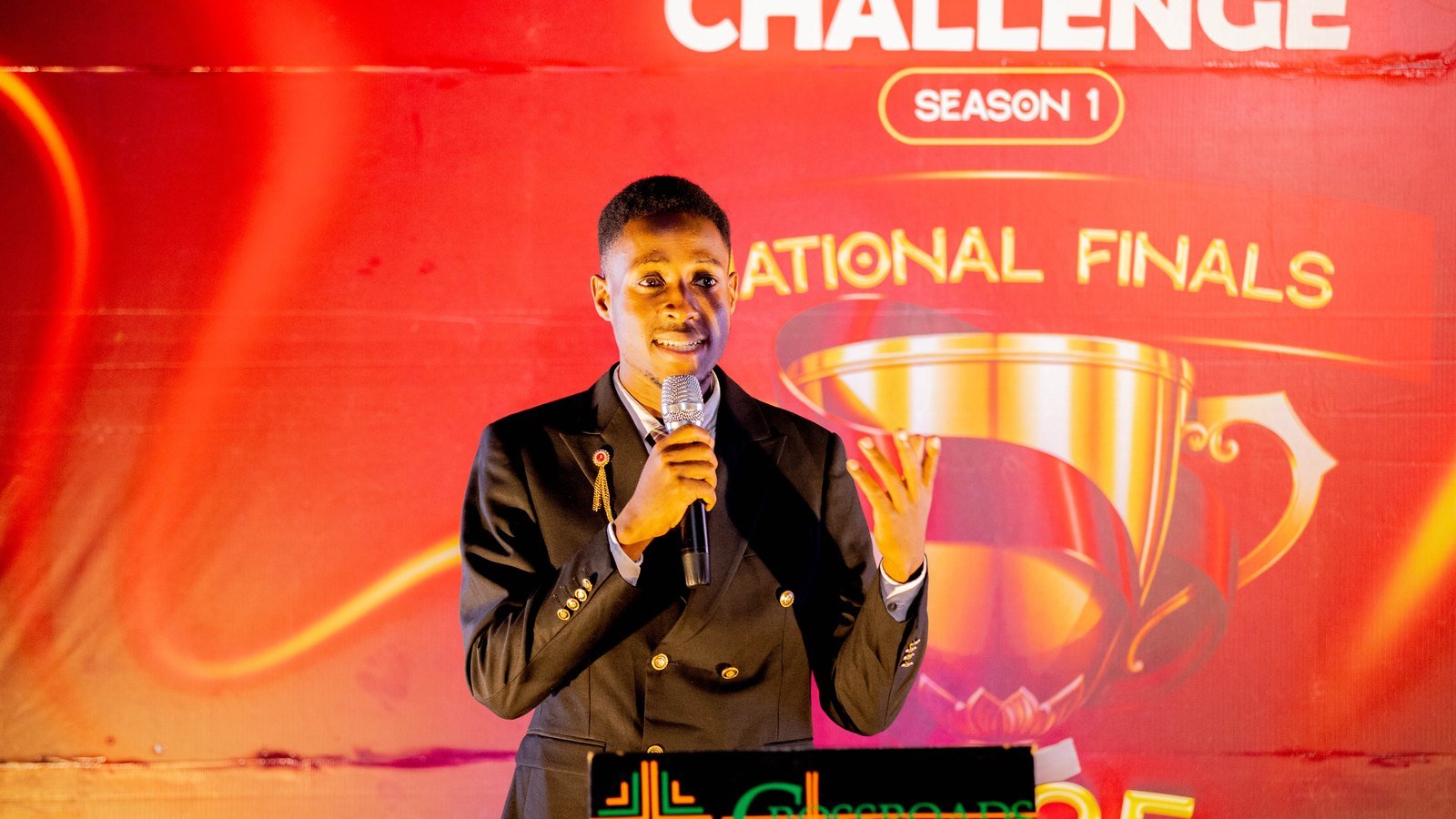 A young builder pitching on stage during the Young Builders Challenge Season 1 national finals